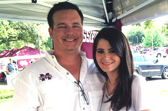 Aaron and his wife, Stephanie, enjoying tailgating.